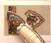 Image of a beaded shoe and matching art work